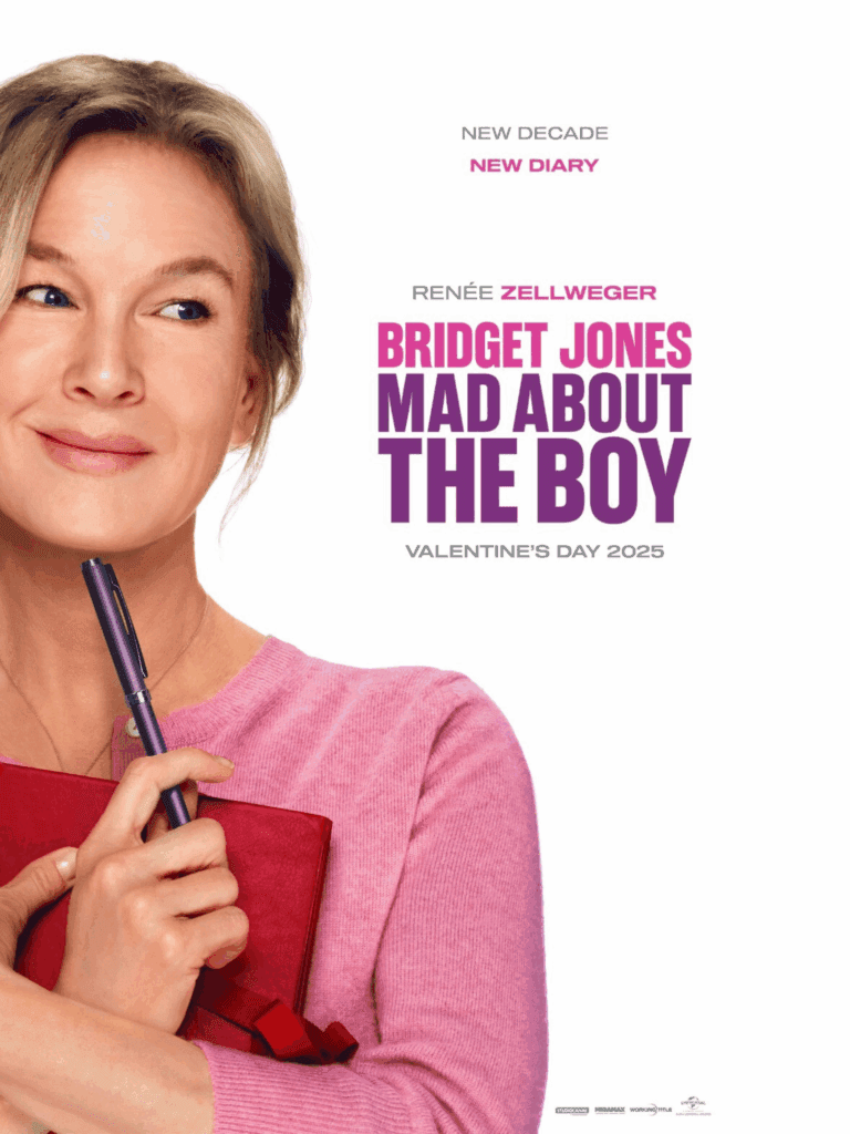 Woman in pink sweater holding a red diary and pen looking to the side